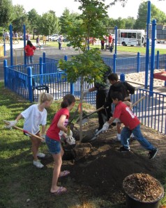Photo of Youth Planting a Tree in Lincoln, NE. (courtesy ReTree NE)